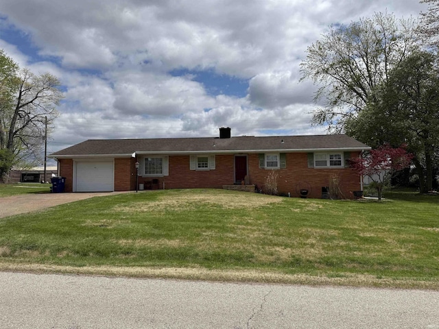 ranch-style home featuring a garage, a front yard, a chimney, brick siding, and driveway