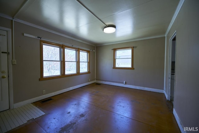 interior space with baseboards, ornamental molding, concrete flooring, and visible vents