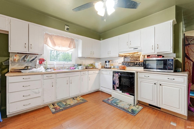 kitchen with white dishwasher, a sink, stainless steel microwave, electric stove, and under cabinet range hood