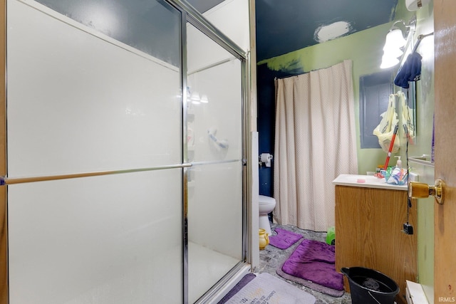 full bath with toilet, a shower stall, and vanity