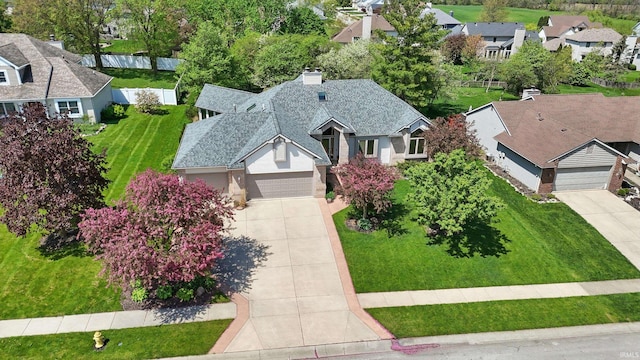 birds eye view of property with a residential view