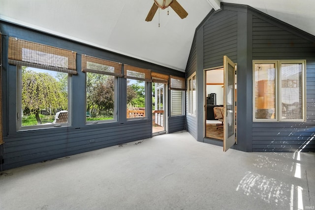 unfurnished sunroom featuring ceiling fan