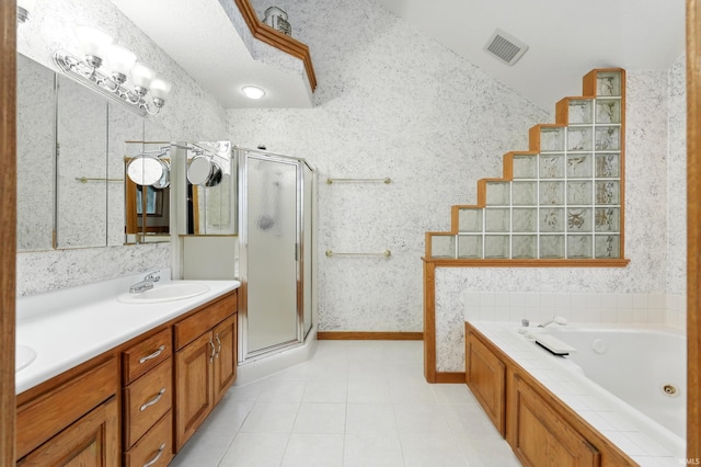 bathroom featuring vanity, tile patterned floors, a shower stall, and visible vents