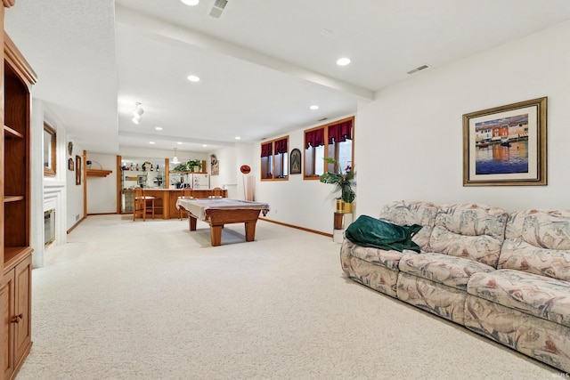playroom with light colored carpet, recessed lighting, baseboards, and bar area