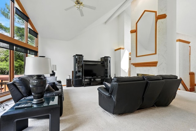 living area featuring carpet floors, high vaulted ceiling, and ceiling fan