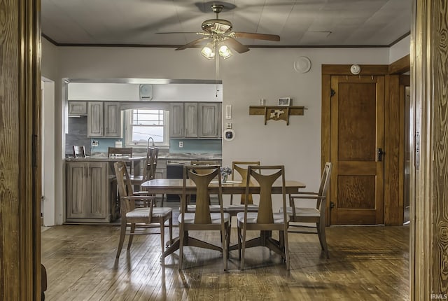 2165 S 625 W, South Whitley, IN 46787 - dining room featuring dark wood-style flooring, a ceiling fan, and crown molding