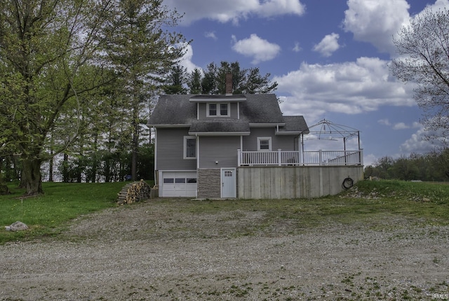 2165 S 625 W, South Whitley, IN 46787 - back of property with an attached garage, a chimney, a shingled roof, and dirt driveway