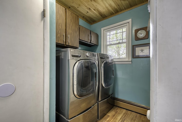 2165 S 625 W, South Whitley, IN 46787 - clothes washing area featuring cabinet space, baseboard heating, separate washer and dryer, light wood-type flooring, and wood ceiling