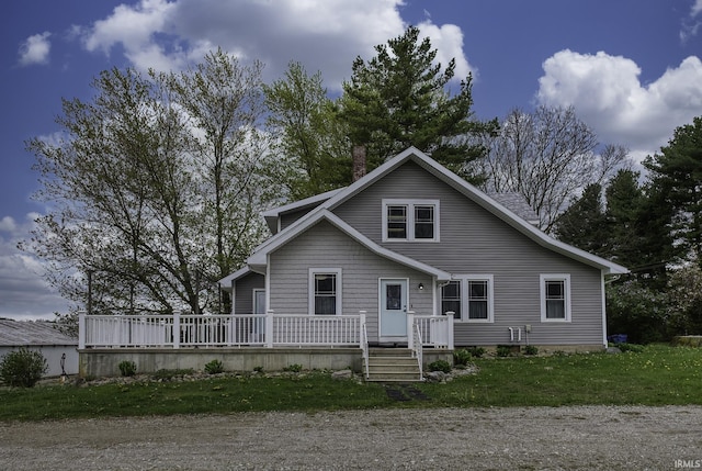 2165 S 625 W, South Whitley, IN 46787 - view of front of home featuring a deck, a chimney, and a front yard
