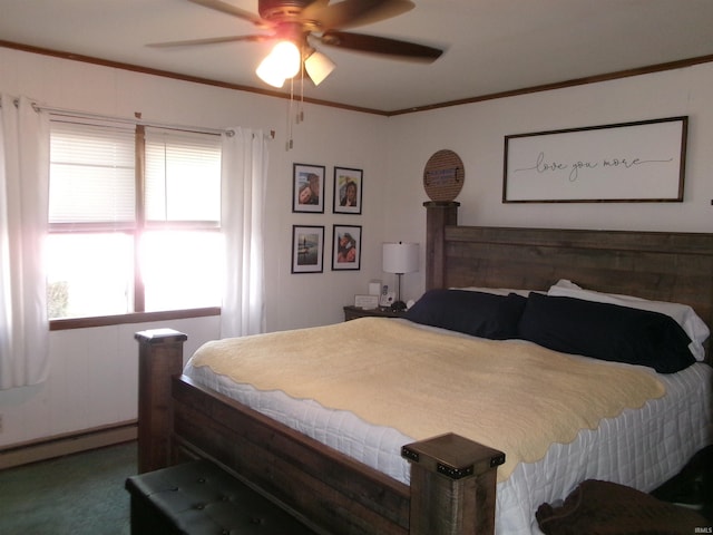 bedroom with a ceiling fan, a baseboard heating unit, multiple windows, and ornamental molding