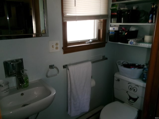 half bath with a sink and toilet