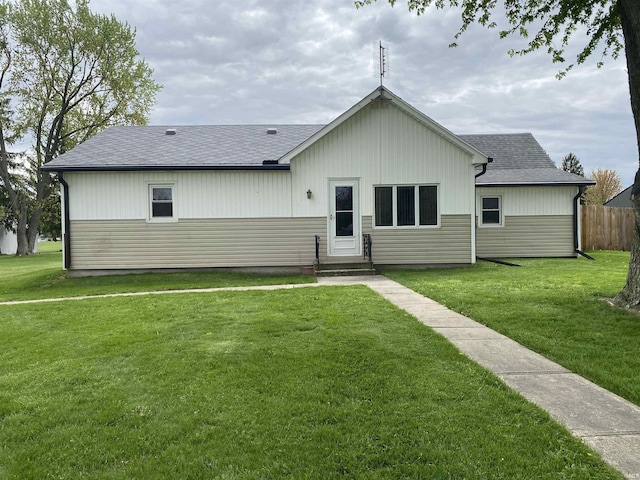 870 W 950 Rd S, Geneva, IN 46740 - back of house with a lawn, fence, and a shingled roof