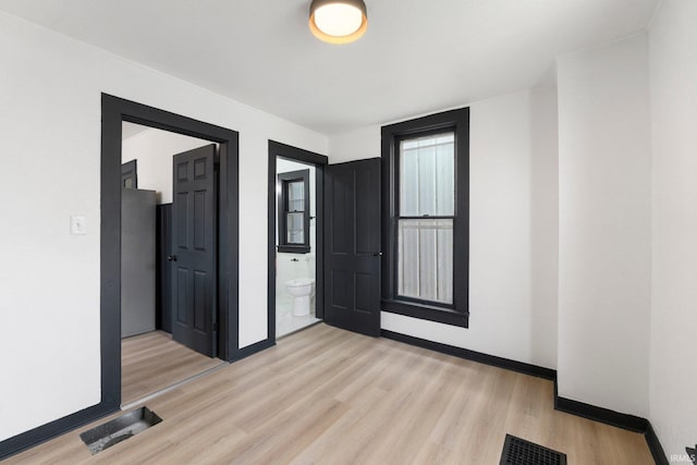1820 W Main St, Fort Wayne, IN 46808 - unfurnished room with baseboards, visible vents, and light wood-type flooring