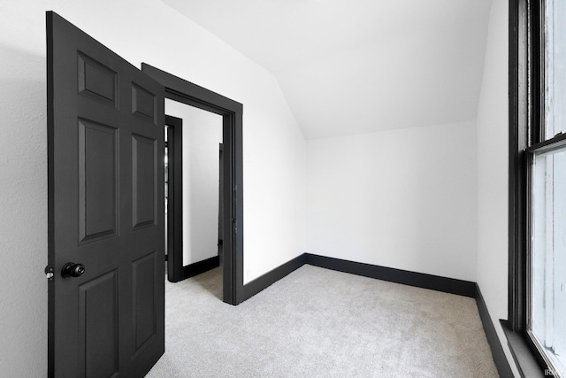1820 W Main St, Fort Wayne, IN 46808 - additional living space featuring baseboards, light carpet, and vaulted ceiling