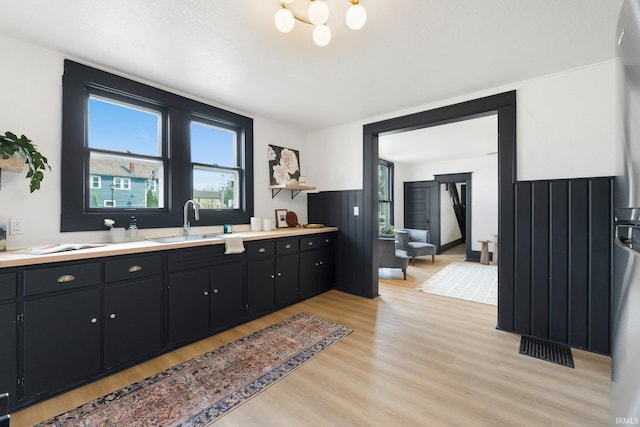 1820 W Main St, Fort Wayne, IN 46808 - bathroom with a chandelier, visible vents, wood finished floors, and vanity
