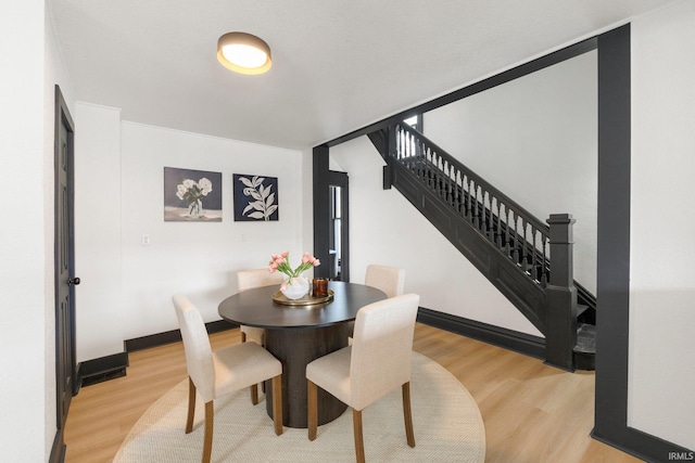 1820 W Main St, Fort Wayne, IN 46808 - dining space featuring light wood-type flooring and stairway