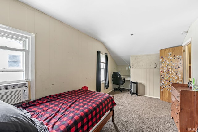 bedroom with radiator heating unit, carpet floors, cooling unit, and lofted ceiling