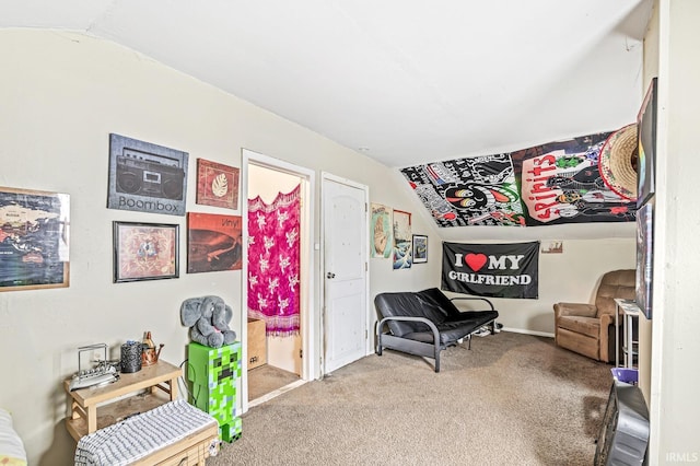 living area featuring carpet floors and lofted ceiling