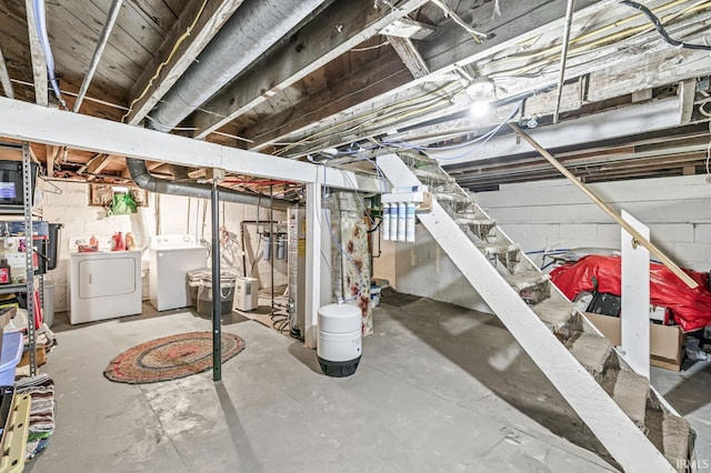 unfinished basement featuring independent washer and dryer
