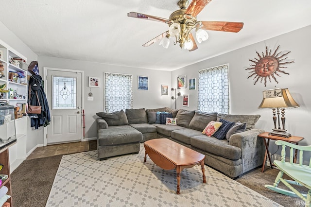 living area with ceiling fan