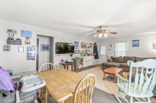 dining space with ceiling fan
