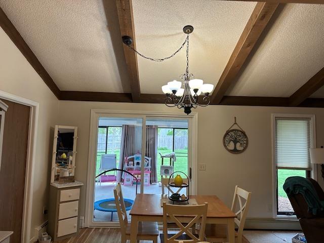 8615 Timbermill Pl, Fort Wayne, IN 46804 - dining room featuring beam ceiling, a chandelier, a textured ceiling, light wood-type flooring, and baseboards