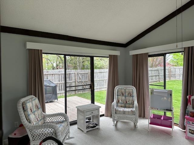 8615 Timbermill Pl, Fort Wayne, IN 46804 - living area with vaulted ceiling, plenty of natural light, and carpet flooring