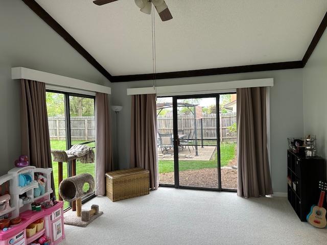 8615 Timbermill Pl, Fort Wayne, IN 46804 - playroom with vaulted ceiling, carpet floors, a ceiling fan, and ornamental molding