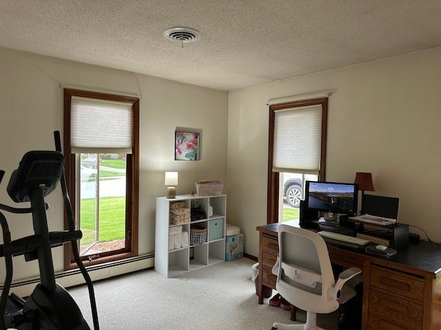 8615 Timbermill Pl, Fort Wayne, IN 46804 - office with carpet flooring, a textured ceiling, visible vents, and a baseboard radiator
