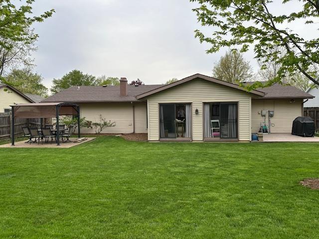 8615 Timbermill Pl, Fort Wayne, IN 46804 - back of house featuring a patio area and a chimney