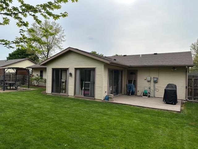 8615 Timbermill Pl, Fort Wayne, IN 46804 - back of property featuring fence, a gazebo, a wooden deck, a lawn, and a patio