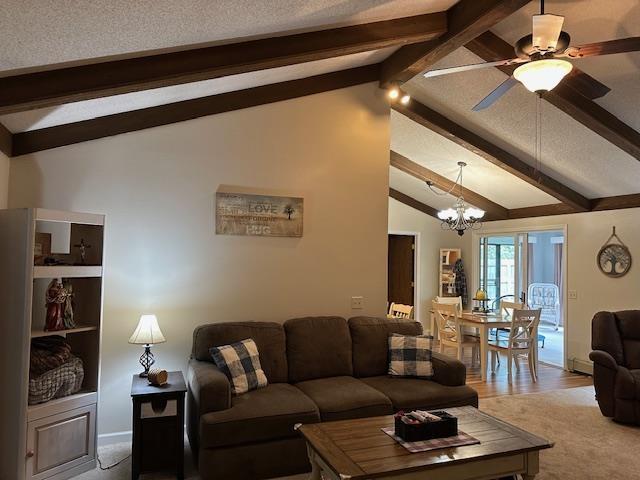 8615 Timbermill Pl, Fort Wayne, IN 46804 - carpeted living area featuring baseboards, lofted ceiling with beams, and ceiling fan with notable chandelier
