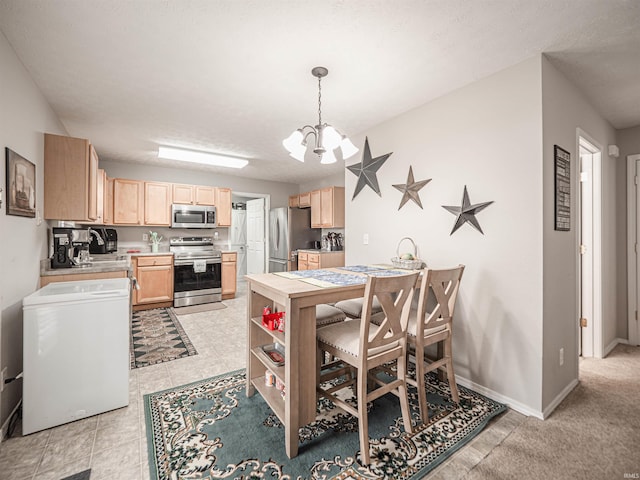 dining room with baseboards, light tile patterned floors, and a notable chandelier