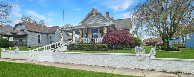 321 S Court St, Sullivan, IN 47882 - view of front of house with a porch and a front yard