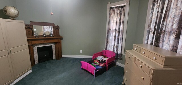 321 S Court St, Sullivan, IN 47882 - sitting room with carpet floors, baseboards, and a tile fireplace