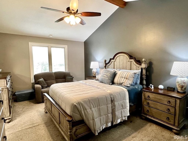 bedroom featuring light colored carpet, a ceiling fan, and vaulted ceiling with beams