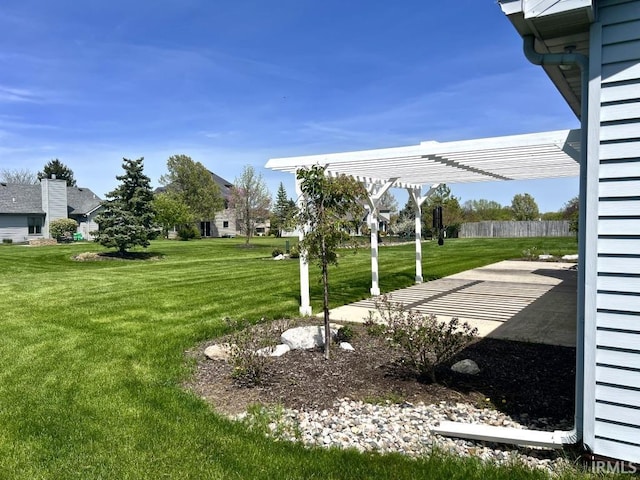 view of yard with a pergola and a patio area
