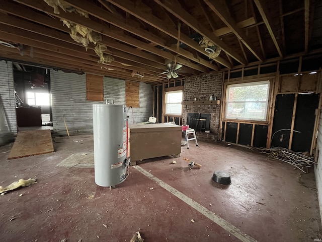 miscellaneous room with a brick fireplace, ceiling fan, plenty of natural light, and gas water heater