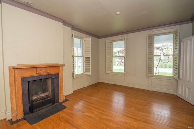 113 W N Shore Dr, South Bend, IN 46617 - unfurnished living room featuring crown molding, wood finished floors, and a tile fireplace