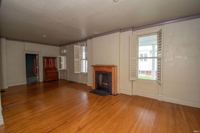 113 W N Shore Dr, South Bend, IN 46617 - unfurnished living room featuring a premium fireplace, baseboards, and light wood-style floors