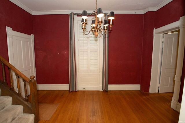 113 W N Shore Dr, South Bend, IN 46617 - dining area featuring baseboards, a chandelier, wood finished floors, and stairway