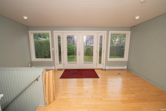 113 W N Shore Dr, South Bend, IN 46617 - doorway featuring brick wall, light wood-style floors, baseboard heating, wood ceiling, and french doors