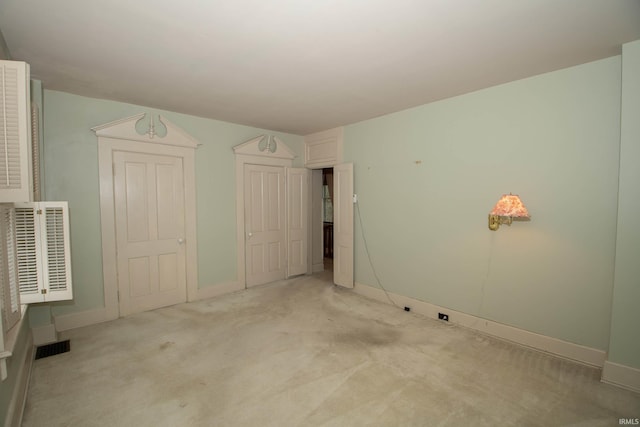 113 W N Shore Dr, South Bend, IN 46617 - unfurnished bedroom with baseboards, carpet floors, and visible vents