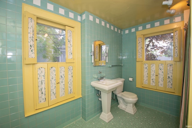 113 W N Shore Dr, South Bend, IN 46617 - half bath with tile patterned floors, toilet, and tile walls