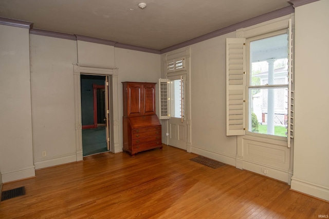 113 W N Shore Dr, South Bend, IN 46617 - unfurnished bedroom featuring crown molding, light wood finished floors, and visible vents