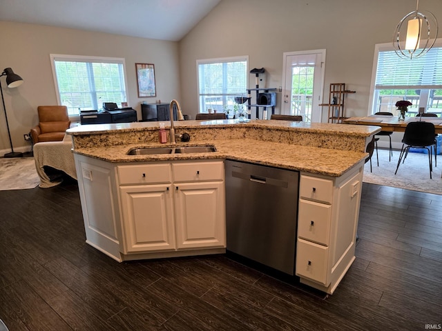 kitchen with dark wood-style flooring, light stone countertops, a sink, dishwasher, and open floor plan
