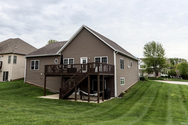 back of house featuring a lawn, stairs, a patio area, and a deck