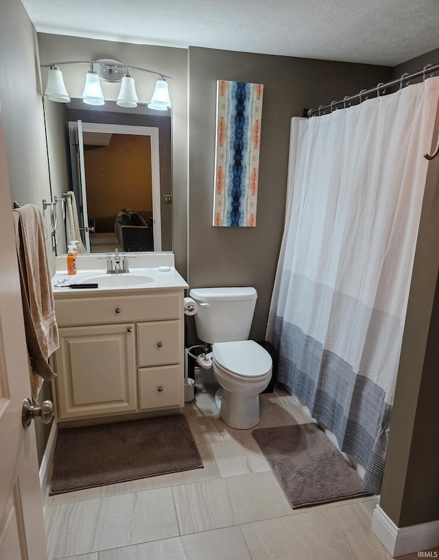 bathroom with vanity, a shower with curtain, and toilet