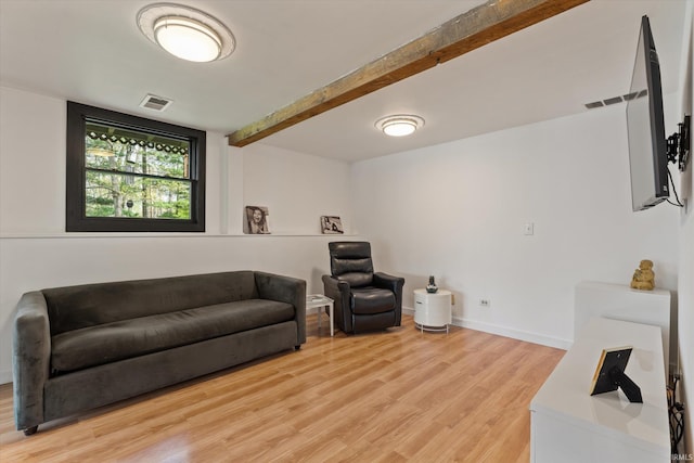 15860 Cook Lake Trl, Plymouth, IN 46563 - living room featuring baseboards, beamed ceiling, light wood finished floors, and visible vents