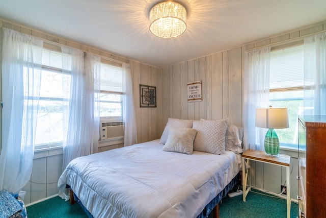 bedroom featuring carpet floors and a notable chandelier